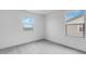 Bright bedroom featuring neutral carpet, bright white walls, and two large windows at 3974 E Ghost Flower Ln, San Tan Valley, AZ 85140
