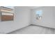 Bright bedroom featuring neutral carpet, bright white walls, and two windows at 3974 E Ghost Flower Ln, San Tan Valley, AZ 85140