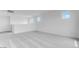 Large room featuring neutral carpet, bright white walls, and three large windows at 3974 E Ghost Flower Ln, San Tan Valley, AZ 85140