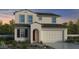 Charming two-story home featuring a neutral color scheme, arched entryway, and a spacious two-car garage at 3974 E Ghost Flower Ln, San Tan Valley, AZ 85140