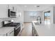 Well-lit kitchen featuring stainless steel appliances, sleek countertops, and an open design at 3974 E Ghost Flower Ln, San Tan Valley, AZ 85140