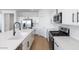 Stylish kitchen with white countertops, stainless steel appliances, sleek fixtures, and modern cabinetry at 3974 E Ghost Flower Ln, San Tan Valley, AZ 85140