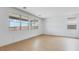 Bright living room featuring hardwood floors and large windows offering lots of natural light at 3974 E Ghost Flower Ln, San Tan Valley, AZ 85140