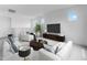 Bright living room featuring neutral walls, modern furniture, and an open concept layout at 3974 E Ghost Flower Ln, San Tan Valley, AZ 85140