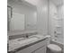 Bathroom with a granite countertop, a large mirror, and combined shower/tub unit at 39970 W Bravo Dr, Maricopa, AZ 85138