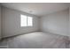 Spacious bedroom with carpet and bright window at 39970 W Bravo Dr, Maricopa, AZ 85138