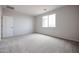 Light and airy bedroom with carpet and a window at 39970 W Bravo Dr, Maricopa, AZ 85138