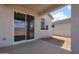 Home features a covered patio, providing shade and a view of the spacious backyard at 39970 W Bravo Dr, Maricopa, AZ 85138