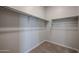 Large closet with poles for organized storage, and carpet at 39970 W Bravo Dr, Maricopa, AZ 85138