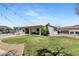 This home has a spacious lawn and a covered patio perfect for relaxing or entertaining outdoors at 4115 S 75Th Dr, Phoenix, AZ 85043