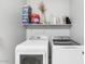 Functional laundry area with modern washer/dryer and practical shelving at 4115 S 75Th Dr, Phoenix, AZ 85043