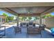 Spacious outdoor kitchen with a built-in grill, sink, and seating area, perfect for outdoor gatherings at 4115 S 75Th Dr, Phoenix, AZ 85043