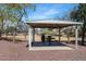 Neighborhood pavilion with metal roof, picnic table and barbecue in park-like setting at 4115 S 75Th Dr, Phoenix, AZ 85043