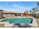 Backyard pool and patio area with fire pit, BBQ, and desert landscaping at 4115 S 75Th Dr, Phoenix, AZ 85043
