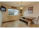 Cozy dining area featuring a wood table, bench seating, and soft lighting for intimate meals at 4238 W Krall St, Phoenix, AZ 85019
