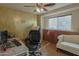 Functional home office with comfortable chair, ample desk space, and lots of natural light at 4238 W Krall St, Phoenix, AZ 85019