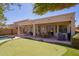 Beautiful backyard featuring pool, putting green, patio, and barbecue area at 45140 W Zion Rd, Maricopa, AZ 85139