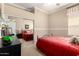 Cozy bedroom with a large mirrored closet door, neutral walls, and carpet at 45140 W Zion Rd, Maricopa, AZ 85139