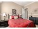 Bright bedroom with bedside tables, neutral paint, carpet, and natural lighting at 45140 W Zion Rd, Maricopa, AZ 85139