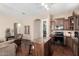 Open kitchen with stainless steel appliances, granite countertops, and a center island at 45140 W Zion Rd, Maricopa, AZ 85139