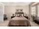 Main bedroom with neutral paint, carpet, and a large decorative headboard with matching side tables at 45140 W Zion Rd, Maricopa, AZ 85139