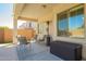 Inviting covered patio with outdoor seating area, perfect for entertaining at 45140 W Zion Rd, Maricopa, AZ 85139