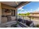 Large balcony has a complete outdoor kitchen plus stylish seating and an expansive community view at 5250 E Deer Valley Dr # 243, Phoenix, AZ 85054