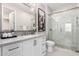 Elegant bathroom features a glass-enclosed shower, quartz countertop and stylish finishes at 5250 E Deer Valley Dr # 243, Phoenix, AZ 85054