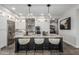 Modern kitchen with stainless steel appliances, island with seating and pendant lighting at 5250 E Deer Valley Dr # 243, Phoenix, AZ 85054