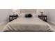 Luxurious main bedroom with a king-size bed, side tables, lamps, and elegant decor at 5250 E Deer Valley Dr # 243, Phoenix, AZ 85054