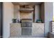 Outdoor kitchen with stainless steel grill and stylish backsplash, ideal for entertaining at 5250 E Deer Valley Dr # 243, Phoenix, AZ 85054