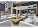 Relaxing patio featuring comfortable couches, a fire pit, and outdoor dining at 5250 E Deer Valley Dr # 243, Phoenix, AZ 85054