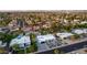 Aerial shot of a community showcasing diverse homes, lush landscaping, and private backyard pool and patio spaces at 5642 E Justine Rd, Scottsdale, AZ 85254