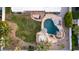 Aerial view of a private backyard oasis with pool, spa, lounge area, and lush landscaping, creating a relaxing retreat at 5642 E Justine Rd, Scottsdale, AZ 85254