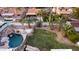 Backyard with a rock waterfall pool, surrounded by cactus and plants, creating a private desert oasis at 5642 E Justine Rd, Scottsdale, AZ 85254