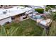 Aerial view of a backyard showcasing a pool, spa, lounge area, grill, and lush landscaping, perfect for outdoor living at 5642 E Justine Rd, Scottsdale, AZ 85254