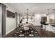 Bright dining room with a modern table, stylish chairs, and elegant chandelier at 5642 E Justine Rd, Scottsdale, AZ 85254