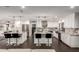 Spacious kitchen featuring two large islands with seating, stainless steel appliances, and modern countertops at 5642 E Justine Rd, Scottsdale, AZ 85254