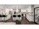 Open kitchen with granite countertops, stainless steel appliances, island with seating, and tile backsplash at 5642 E Justine Rd, Scottsdale, AZ 85254
