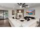 Inviting living room boasts a cozy fireplace, stylish furniture, and large windows for natural light at 5642 E Justine Rd, Scottsdale, AZ 85254