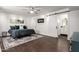 Bright bedroom with ceiling fan, sliding barn door, and ensuite bathroom at 5642 E Justine Rd, Scottsdale, AZ 85254