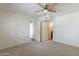 Spacious bedroom with neutral carpet and multiple doorways at 5877 N Granite Reef Rd # 1155, Scottsdale, AZ 85250