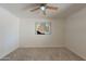 Neutral bedroom with carpet, ceiling fan, and abstract wall art at 5877 N Granite Reef Rd # 1155, Scottsdale, AZ 85250