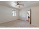Neutral bedroom with carpet, ceiling fan, and view to hallway at 5877 N Granite Reef Rd # 1155, Scottsdale, AZ 85250
