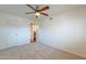 Bedroom with a ceiling fan, carpet flooring, and an open doorway to another room at 5877 N Granite Reef Rd # 1155, Scottsdale, AZ 85250