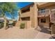Inviting condo exterior featuring a private balcony, neutral stucco, and low-maintenance desert landscaping at 5877 N Granite Reef Rd # 1155, Scottsdale, AZ 85250