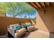 Covered patio featuring comfortable seating, cushions and desert landscaping at 5877 N Granite Reef Rd # 1155, Scottsdale, AZ 85250