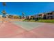 Community tennis court with a well-maintained surface and surrounding green spaces at 5877 N Granite Reef Rd # 1155, Scottsdale, AZ 85250