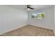 This is a second bedroom view, with carpet, neutral paint, and a window at 7507 E Beatrice St, Scottsdale, AZ 85257