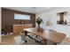 Inviting dining room with wood paneling, modern furnishings, and natural light, perfect for gatherings at 7507 E Beatrice St, Scottsdale, AZ 85257